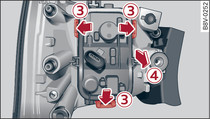 Securing tabs between bulb carrier and rear light