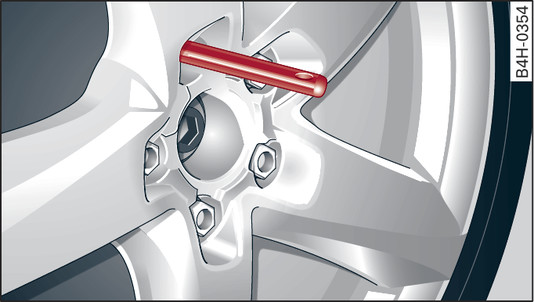 Fig. 333 Wheel: Mounting pin in wheel bolt hole nearest to the top