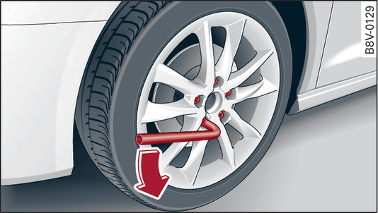 Fig. 329 Wheel: Loosening the wheel bolts