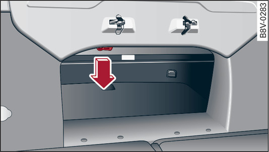 Fig. 42 Rear seats folded down: Release ring for lid of soft top storage box