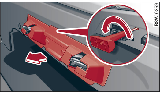 Fig. 52 Rear seat bench: Unlocking the storage box lid with the release tool