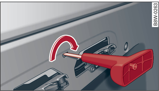 Fig. 57 Rear seat bench: Locking the storage box lid with the release tool