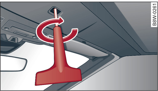 Fig. 55Parte interior da capota: Trancar a capota com o manípulo de desbloqueio de emergência